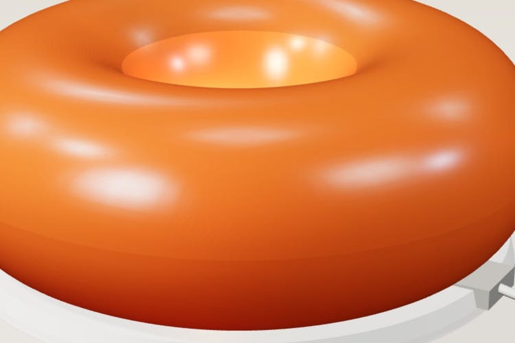 The VARMBLIXT amber glass ring lamp, glowing